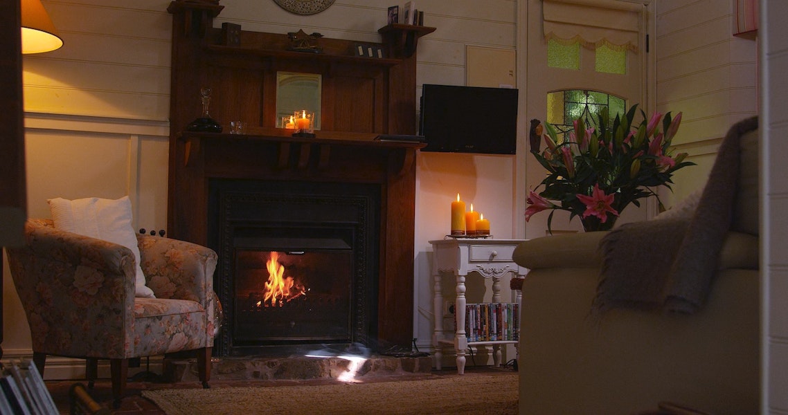 Twilight cottage lounge by the fire